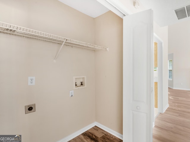 laundry area with visible vents, wood finished floors, hookup for an electric dryer, hookup for a washing machine, and laundry area