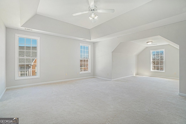 bonus room with a ceiling fan, carpet, and baseboards