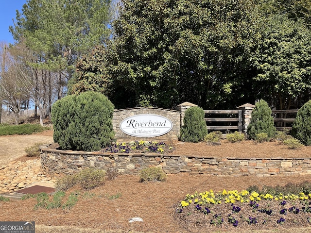 community sign with fence