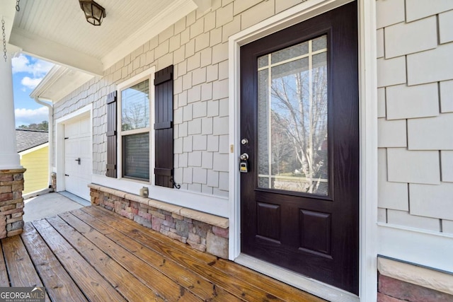 doorway to property featuring a porch