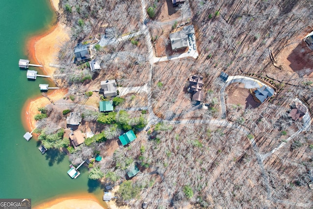 drone / aerial view with a water view