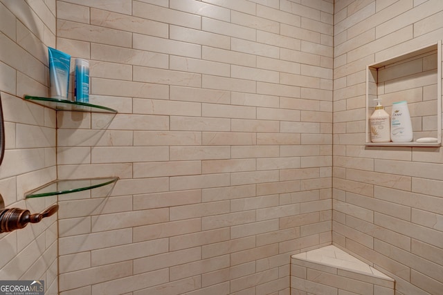 full bathroom with tiled shower