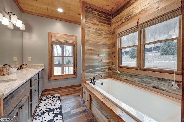 full bathroom with a sink, wood finished floors, wooden ceiling, and wood walls