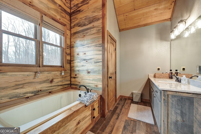 full bath featuring lofted ceiling, wooden ceiling, a bath, vanity, and wood-type flooring