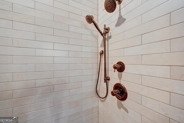 interior details with a tile shower