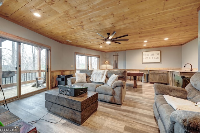 living room featuring recessed lighting, wood ceiling, light wood-type flooring, and wainscoting
