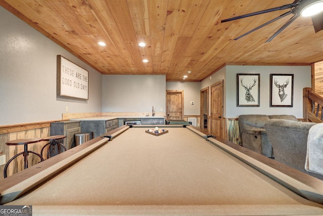 game room with recessed lighting, bar, and wood ceiling