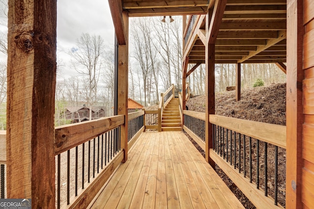 wooden deck featuring stairs