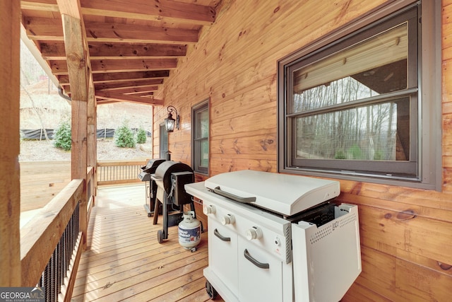 wooden deck featuring area for grilling