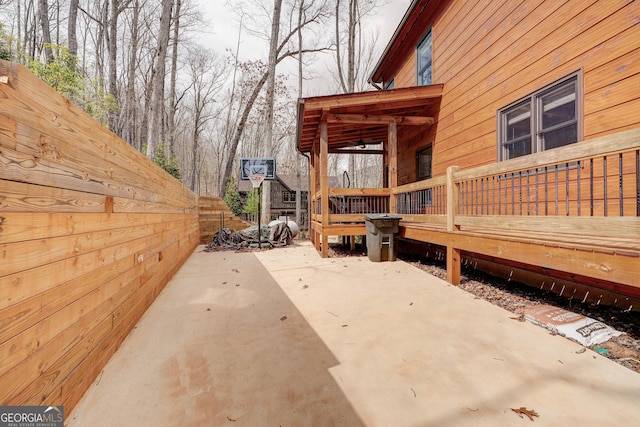 view of patio / terrace featuring fence