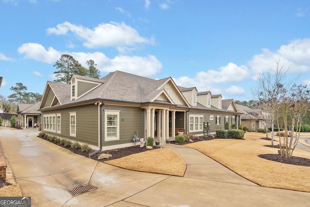 view of front of house with a shingled roof