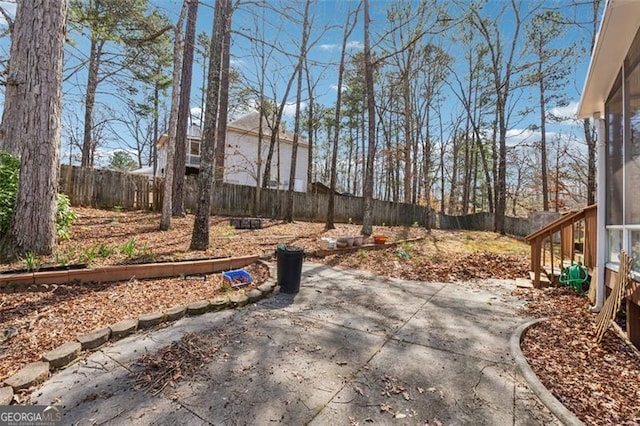 view of yard featuring a patio area and a fenced backyard