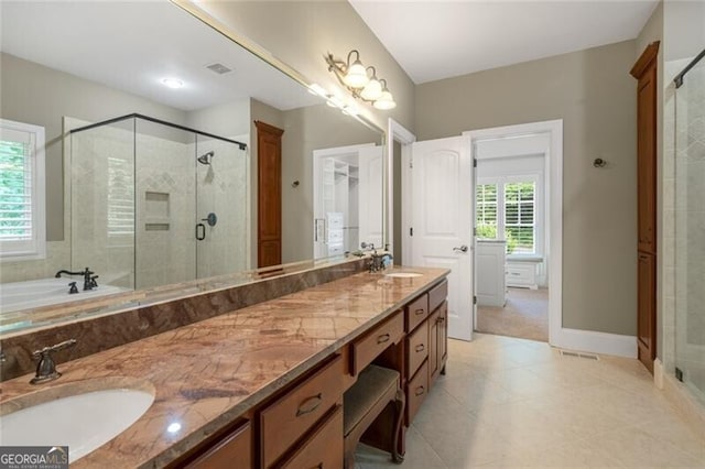 full bathroom featuring a sink, visible vents, double vanity, and a shower stall