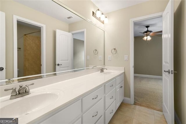 bathroom with tile patterned floors, double vanity, visible vents, and a sink