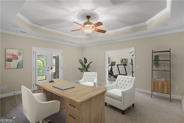 home office featuring ceiling fan, french doors, a raised ceiling, and ornamental molding