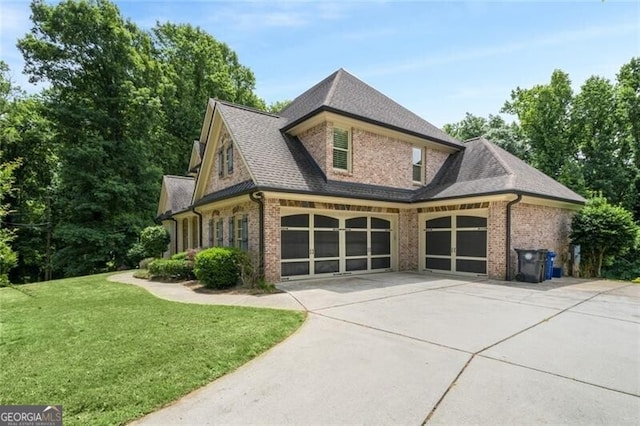 view of property exterior featuring a garage, brick siding, concrete driveway, and a lawn