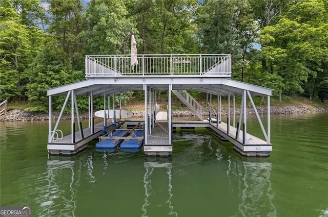 dock area featuring a water view and stairs