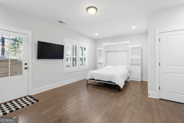 bedroom featuring visible vents, recessed lighting, baseboards, and wood finished floors