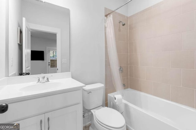 bathroom featuring toilet, vanity, and shower / bath combination with curtain