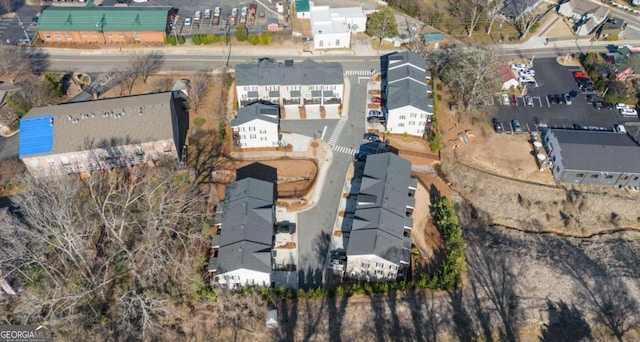 birds eye view of property with a residential view