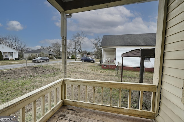 wooden terrace featuring covered porch