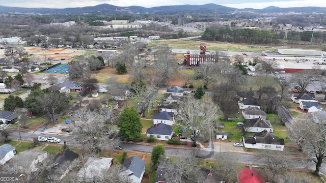 birds eye view of property with a mountain view