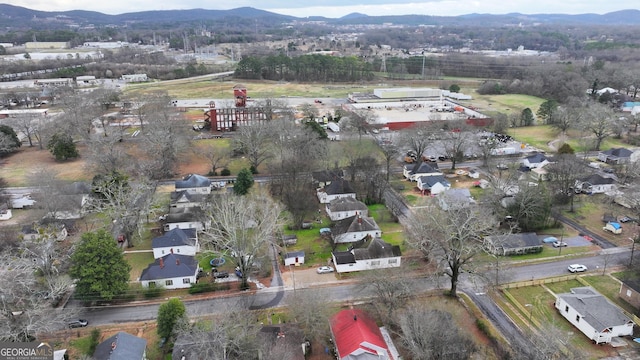 birds eye view of property with a mountain view