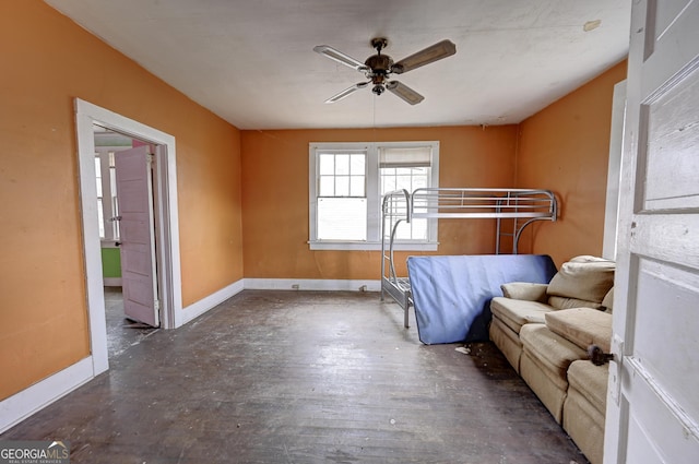 unfurnished bedroom with baseboards and wood finished floors