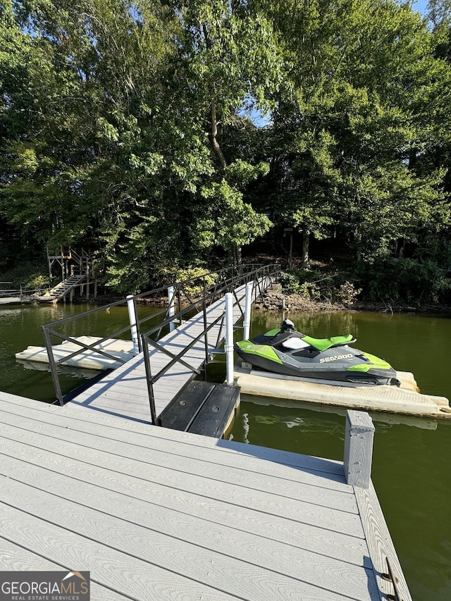 dock area with a water view