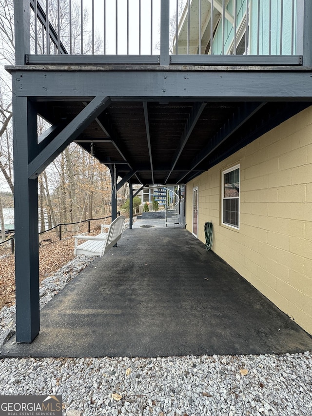 view of parking featuring an attached carport