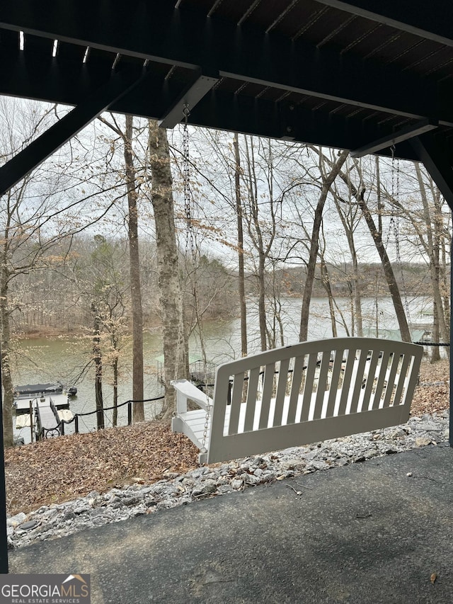 view of yard with fence and a water view