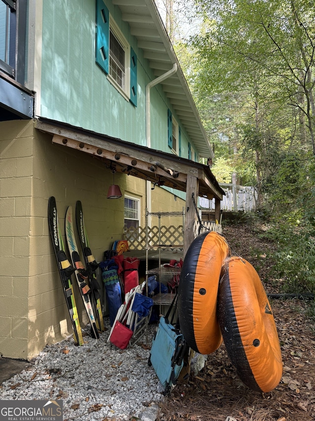 view of property exterior featuring concrete block siding