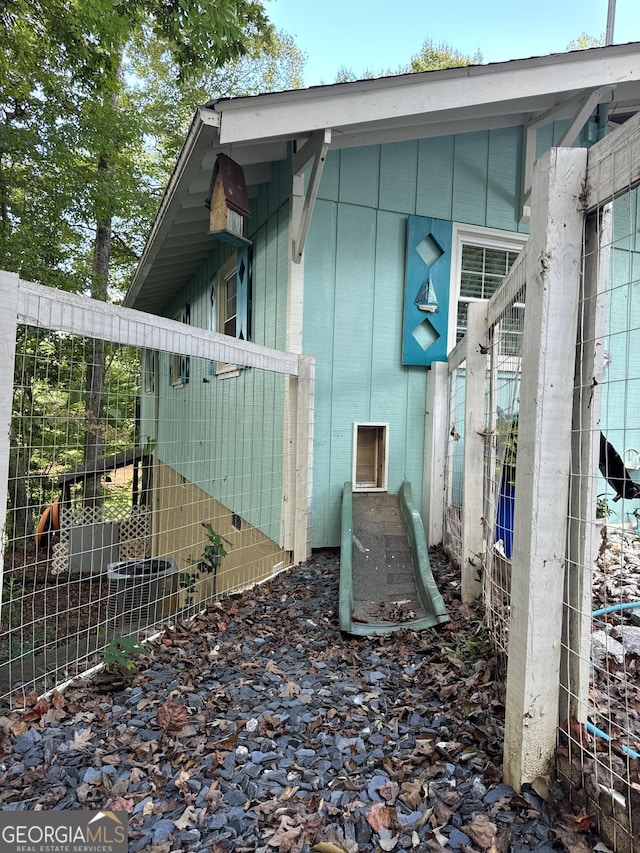 view of side of property featuring brick siding