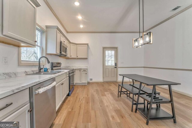 kitchen featuring a wealth of natural light, visible vents, appliances with stainless steel finishes, and a sink