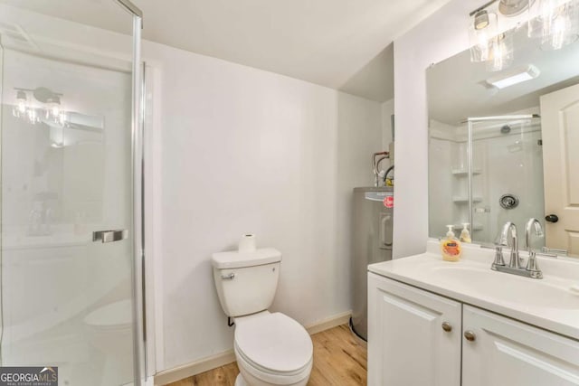 full bath with vanity, wood finished floors, a stall shower, water heater, and toilet