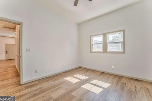 unfurnished room with ceiling fan, baseboards, and light wood-style flooring