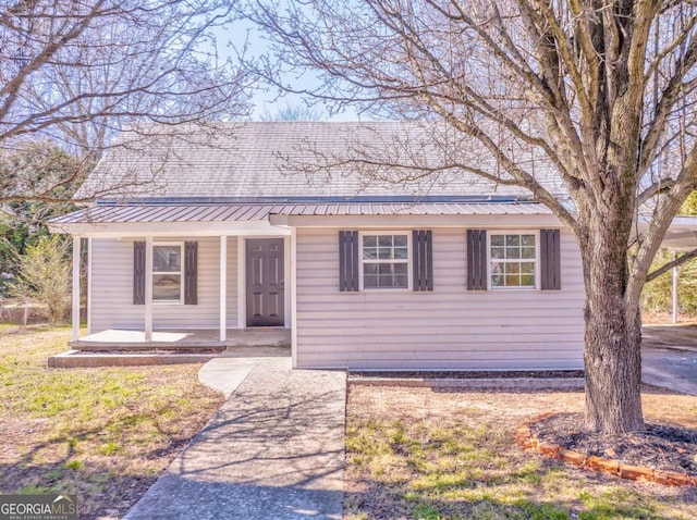 view of front of house with a porch and metal roof