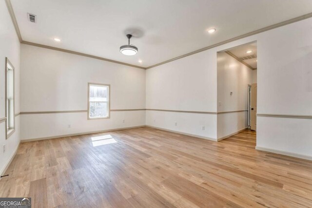 unfurnished room featuring visible vents, baseboards, recessed lighting, crown molding, and light wood-type flooring