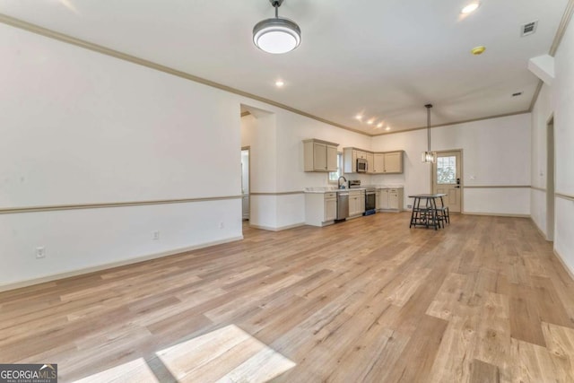 unfurnished living room with visible vents, baseboards, recessed lighting, ornamental molding, and light wood-style floors