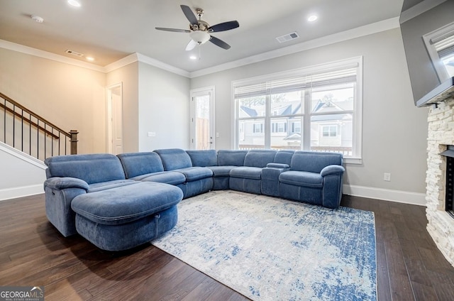 living room featuring visible vents, baseboards, a fireplace, stairs, and dark wood-type flooring