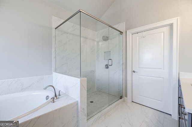 full bath featuring lofted ceiling, a garden tub, marble finish floor, and a marble finish shower