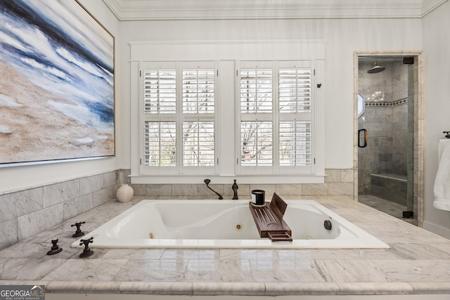 bathroom featuring a stall shower, a jetted tub, and ornamental molding