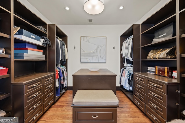 spacious closet featuring visible vents and light wood-style floors