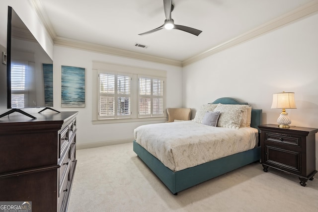 bedroom featuring visible vents, multiple windows, light colored carpet, and ornamental molding