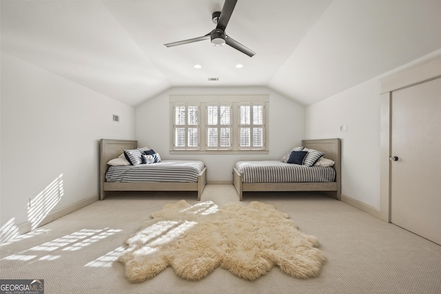 bedroom with visible vents, carpet floors, ceiling fan, and vaulted ceiling