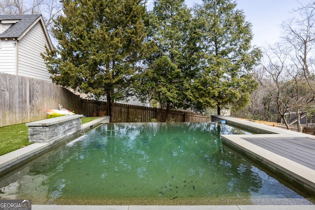 view of pool featuring a fenced backyard