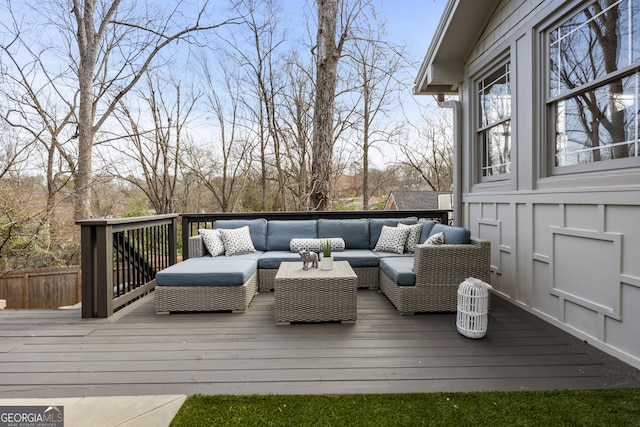 wooden terrace with an outdoor hangout area