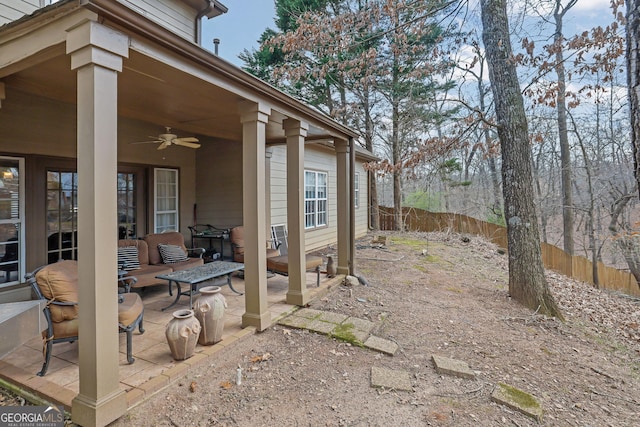 view of patio / terrace featuring fence and ceiling fan