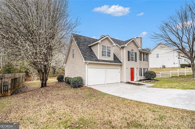 view of front of property featuring fence, driveway, an attached garage, a chimney, and a front lawn