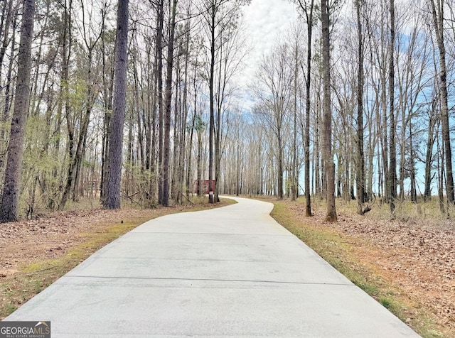 view of home's community featuring a view of trees